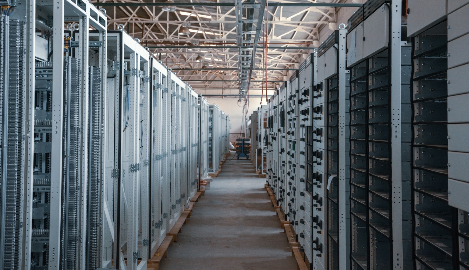 An aisle between equipment racks in a data centre